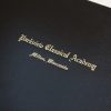 Closeup of custom text stamped on a diploma cover