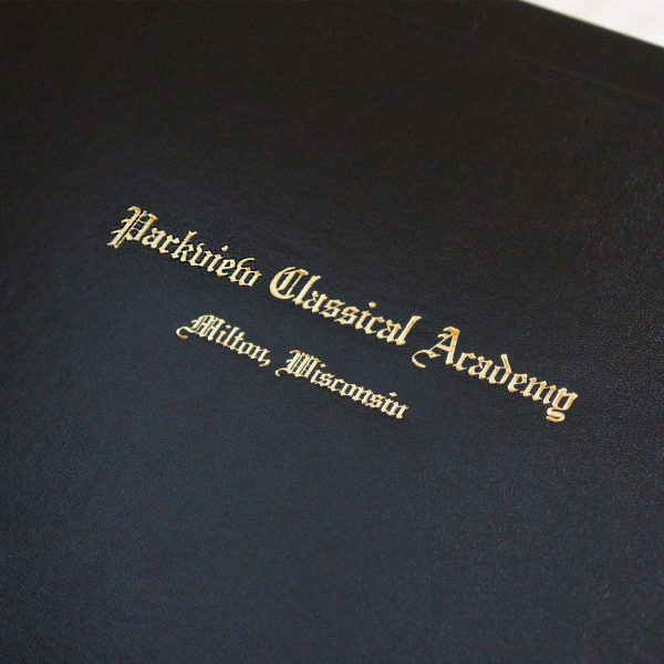 Closeup of custom text stamped on a diploma cover